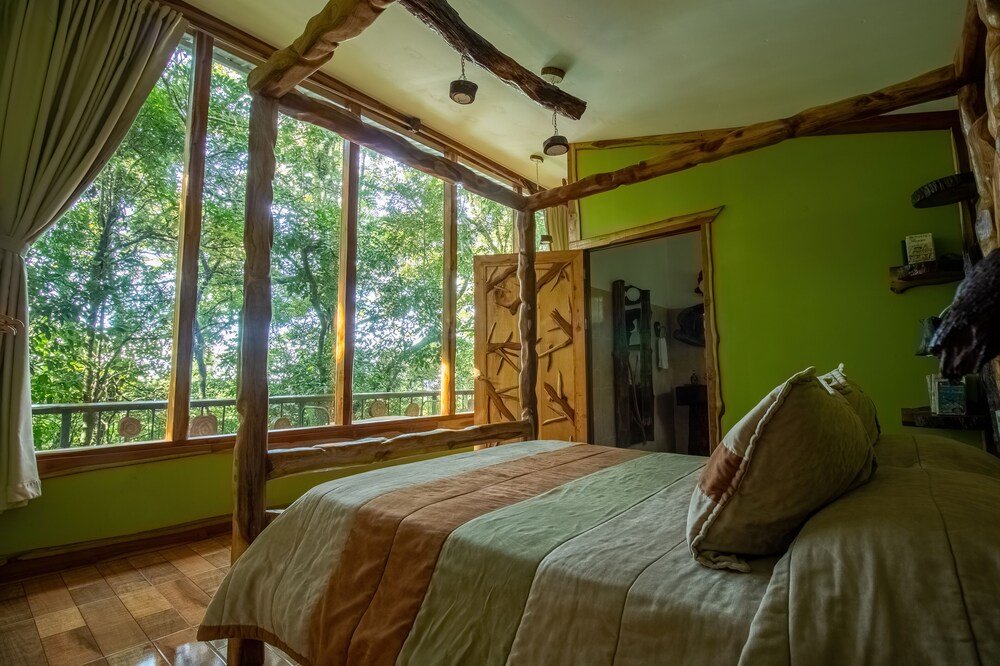 Bedroom at Canopy Wonders House with a view of the Monteverde forest